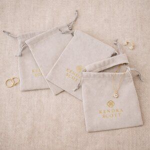 Kendra Scott Gray Drawstring Jewelry Pouches Set of 4 Gold Logo